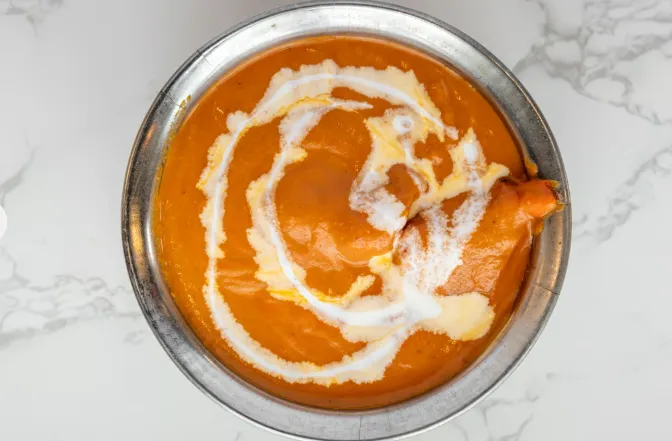 Butter Chicken - Signature creamy tomato curry at Om Cuisine of India Calgary